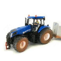 Muddy New Holland Tractor with Ifor Williams Trailer
