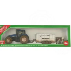 Muddy New Holland Tractor with Ifor Williams Trailer